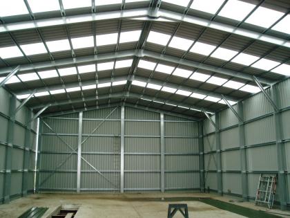 Interior view showing the amount of light from the skylights and the space provided by using a portal frame steel build