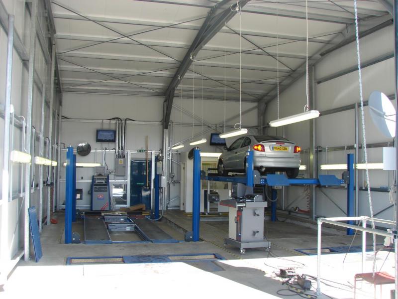 inside view of MOT testing station with two workshop bays