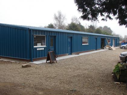 Exterior of single storey, steel framed food processing plant in a Ocean Blue finish