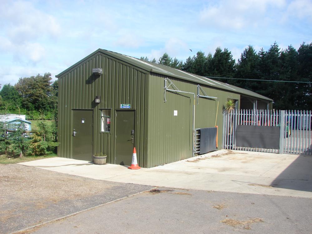 External view of fully galvenised machinery workshop in green steel