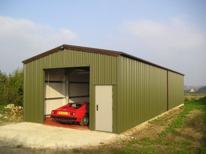 External view of car restoration workshop with steel roller door and PA door