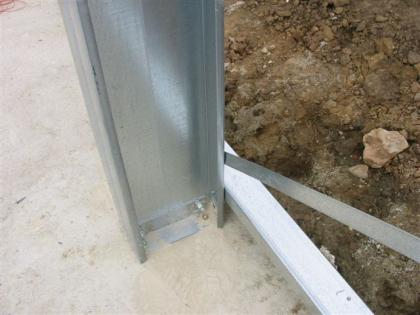 Frame fastened to base using pre-punched anchors